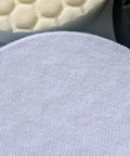 Close-up of three different 6-inch foam buffing pads in white, honeycomb, and black textures for car detailing.