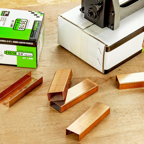 Carton Closing Staples Sixteen Gauge One And Three Eighths Inch Crown By Three Quarters Inch Leg Copper Coated For Pneumatic And Manual Box Staplers 1600 Pack Beefy Hold Heavy Duty Cardboard Sealing Staples on table