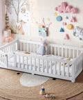 Totally Built Tough Twin Floor Bed With Montessori Design And Complete Safety Guardrails Plus Easy Access Door For Kids, Solid Wood Low Profile Slatted Frame In Fresh White in a cozy nursery with playful decor.