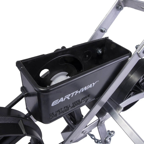 Close-up of seed hopper on Pro Grade Precision Garden Seeder With 7 Seed Plates For Home Gardeners, Sweet Corn Planter