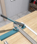Manual Wire Duct Cutter For PVC Trunking And Open Slot Ducts in use, showing adjustable blade and blue handle on wooden table.