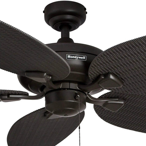 Close-up of Duval 52 Inch Indoor Outdoor Ceiling Fan with Hand Carved Basswood Blades, Bronze Finish, showing pull chain