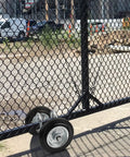 Heavy Duty Gate Wheel 6 Inches With Rubber Roller For Metal Tube Gates And Driveway Fences, attached to a chain link gate.