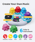 Screen Free Kids DJ Mixer And Manual Music Gear Station Featuring Twin Beat Sliders Scratch Wheel And Interactive Ear Training For Young Pros Whose Grooves Always Hit Different, colorful buttons with six instruments.
