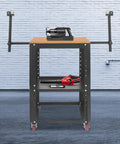 Built Tough Rolling Planer Stand With 550 Lb Capacity Height Adjustable Tool Cart with tools on a stable wooden worktable.