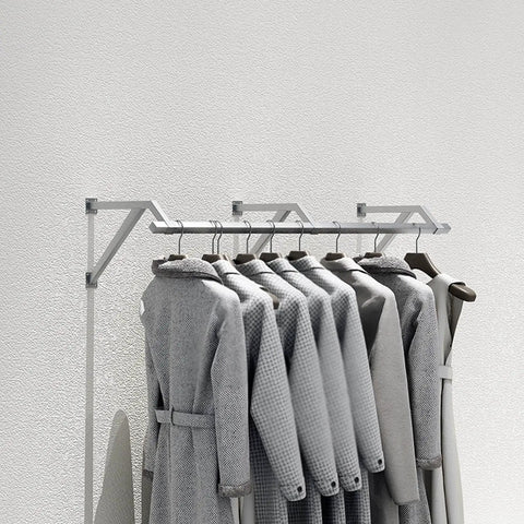 Industrial Pipe Wall Shelf Rustic Metal Display Rack For Clothing And Laundry Garment Bar mounted on white wall