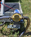 Heavy Duty 12 Volt Portable Oil Transfer Pump Handles All Gear And Engine Oil Swaps Without A Sweat Featuring A Self Priming Design close-up of pump and hose on grass