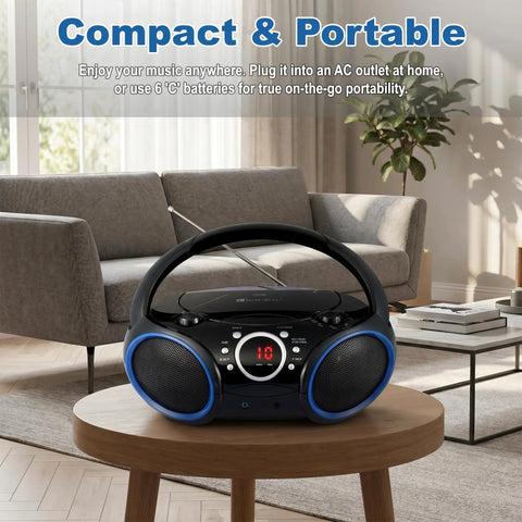 Portable CD Player Boombox With Top-Loading Disc, 20-Track Programmable Memory, Repeat One And All, AM/FM Stereo, on a table