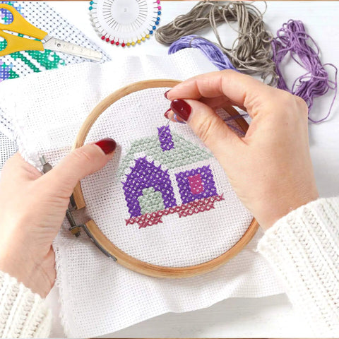 Hands embroidering with 304 Pack Embroidery Starter Kit With 200 Color Floss 5 Bamboo Embroidery Hoops 2 Aida Cloths Easy Instructions Bag And Cross Stitch Tools Set For Beginners And Adults