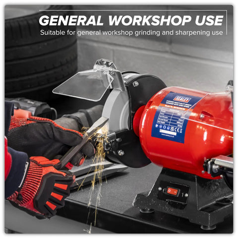 Workhorse 150Mm Bench Grinder Equipped With A Beefy 450W Induction Motor grinding metal with sparks flying in workshop.
