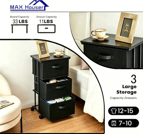 Three Drawer Fabric Dresser Tower with Sturdy Metal Frame in black, beside bed, featuring wood board top and easy pull handles.