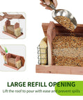 US Cedar Outdoor Bird Feeder With Hanging Design Handcrafted Wood Double Suet Cage Clear View Windows Squirrel Proof Wild Bird Feeder For Cardinals Finches Chickadees being filled with seeds