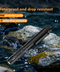 T2A Compact EDC Flashlight 1500 Lumens, Rechargeable AA LED, placed on wet rocks showcasing waterproof feature