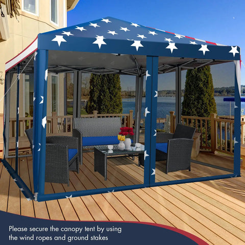 Easy Up 10x10 Pop Up Canopy With Netting And Mesh Sidewalls, Carrying Bag, Adjustable Height, American Flag Outdoor Shade Tent For Backyard And Lawn, 100 Sq Ft Of Shade set up on a wooden deck with patio furniture inside.