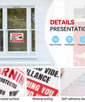 Two Pack Top Shelf Security Camera Warning Stickers With Realistic Video Monitoring Graphics For Warehouses Or Homes High Visibility Vinyl Decals Heavy Duty Adhesive That Really Grips Tight Indoors Outdoors on a window.