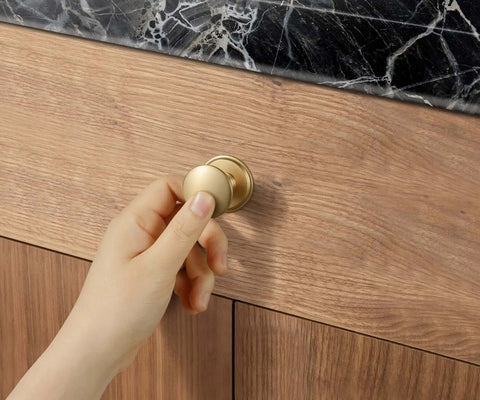 Hand holding Champagne Bronze Zinc Alloy Cabinet Knobs With Plate Six Pack Single Hole Kitchen Cabinet Pulls Drawer Hardware