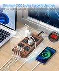Slick Wood Finish Surge Protector Power Strip With Six Widely Spaced Outlets And Dual USB C Plus Dual USB A Ports on desk.