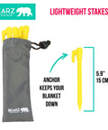 Lightweight Beach Tent Stakes Pack Of Four 5.9 Inch Sand Tarp Pegs with Anchor in safety yellow next to a storage bag