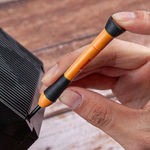 Close-up of orange screwdriver from 39 Piece Home Tool Set With Plastic Toolbox Storage Case Orange used on electronics.