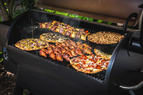Wood Pellet Grill And Smoker That Delivers Wood Fired Flavor With Big 884 Square Inches Cook Area And Bronze Finish in use