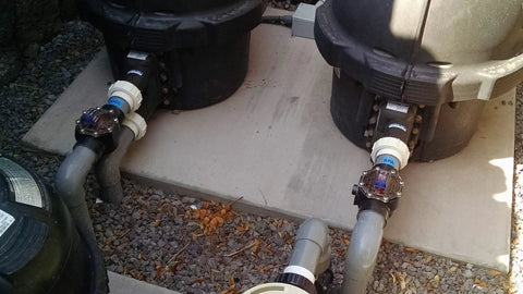 FlowVis FV-C Pool Flow Meter And Check Valve Inline 2 By 2.5 Inch installed beside pool plumbing for accurate flow measurement