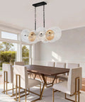 Dining room with rustic drum chandelier with black metal frame and exposed bulbs, 4-light farmhouse pendant lighting over table