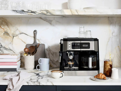 All In One Coffee And Espresso Maker With Dual Heating So You Can Brew Fast And Get Barista Grade Espresso 15 Bar Italian Pump Delivers Rich Flavor Adjustable Milk Frother For Creamy Cappuccinos And Lattes Glass 10 Cup Carafe COM532M Black on kitchen counter