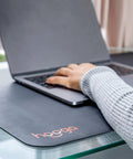 Person using laptop on Grounding Mat For Wellness 24x16 Inch Conductive Carbon Pad With 15 Foot Cord Non Slip Rubber Backing