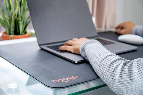 Person using laptop on Grounding Mat For Wellness 24x16 Inch Conductive Carbon Pad With 15 Foot Cord Non Slip Rubber Backing