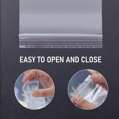 300 Clear Mini Plastic Baggies Two Point Two By Three Inch Reclosable Bags For Beads Jewelry Pills Screws Crafts And Packaging Food Grade Safe Easy Seal Resealable Poly Bags With Blank Sticker Tags, showing clear resealable bag being opened and closed.
