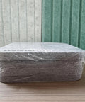 Snag This 4 Pack Of Polyester Fiber Acoustic Panels Self Adhesive Sound Proof Tiles 0.4 Inch Thick stacked on a surface.