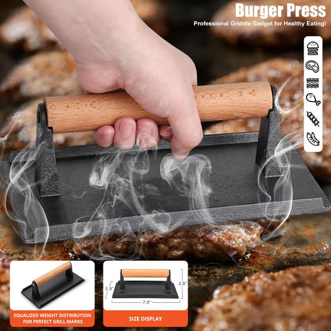 Close-up of a hand using a rectangle bacon press from 42 Piece Flat Top Griddle Accessories Kit on sizzling burger patties.