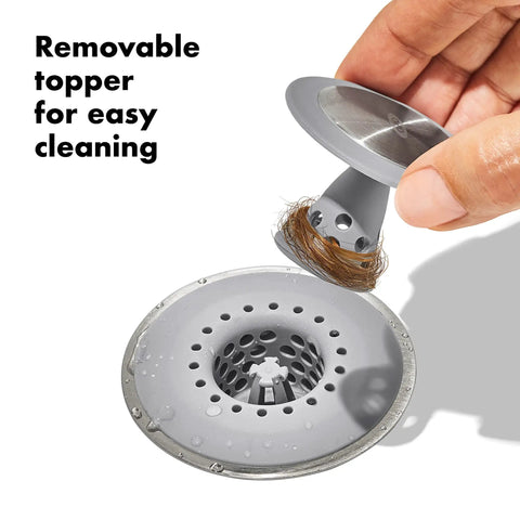 Stainless Steel Hair Catch Drain Protector With Two-Piece Design and Flexible Silicone Cone shown in use with removable topper.