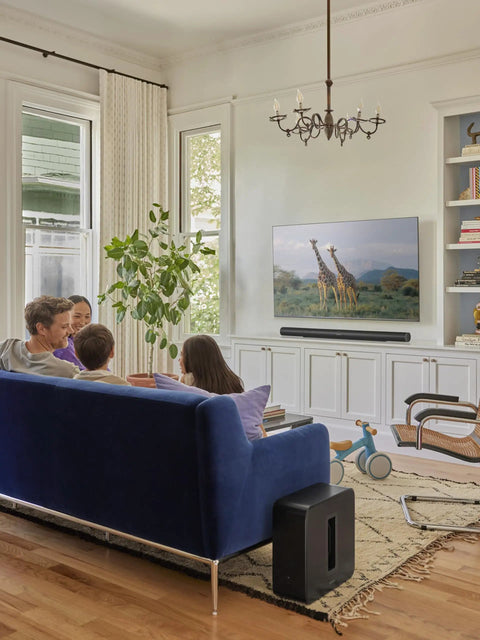 Living room setup with Dope Deep Bass Wireless Subwoofer For Immersive Home Theater With Ported Enclosure next to a sofa