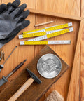 Tough As Nails Stainless Steel Dowel Pins 50 Piece Set For Cabinets Shelves And Wood Furniture on a wooden work table with tools.