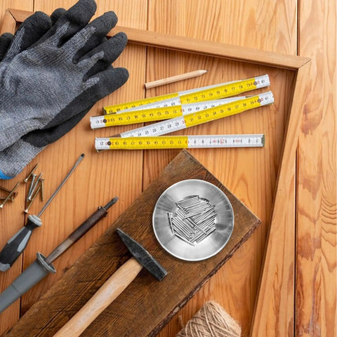 Tough As Nails Stainless Steel Dowel Pins 50 Piece Set For Cabinets Shelves And Wood Furniture on a wooden work table with tools.