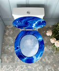 Round Resin Toilet Seat for Bathroom in blue marble design viewed from above, highlighting fittings and surrounding decor.