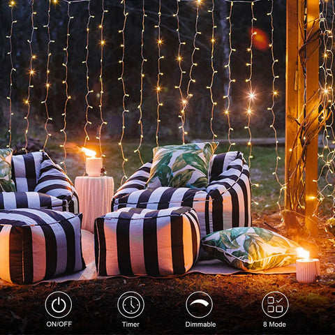 Outdoor setup with chairs and Battery Operated Fairy Curtain Lights With Remote Timer Nine Point Eight Feet By Nine Point Eight Feet Of Warm White LEDs