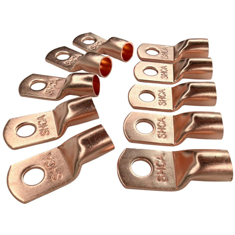 Pack Of Ten 1/0 Gauge Copper Ring Terminal Connectors With Red Black Heat Shrink Tubing 3/8 Inch Stud For Heavy Duty Car Audio Power Wiring That Will Keep Your Bass Rig Amped Up Daily, showing copper connectors arranged on white background.