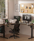 Big Game Changing L Shaped Standing Desk With Cup Holder Electric Height Adjust Corner Computer Workstation Ergonomic Sit Stand Up Home Office Gaming Station Spacious Black Walnut Finish setup in modern workspace with dual monitors.