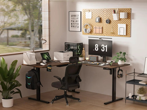 Big Game Changing L Shaped Standing Desk With Cup Holder Electric Height Adjust Corner Computer Workstation Ergonomic Sit Stand Up Home Office Gaming Station Spacious Black Walnut Finish setup in modern workspace with dual monitors.