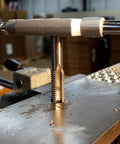 5/8-11 National Fine Plug Tap For Metalworking Projects In High Carbon Steel in use on a workbench, Century Drill Model 95115