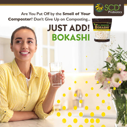 Woman holding a glass beside a package of Dry Bokashi Bran Compost Starter For Kitchen And Outdoor Bins 2 Lbs Pack Low Odor Chemical Free And Fast Finish For Food Scraps And Pet Waste Easy Way To Kickstart Fermentation And Accelerate Composting.