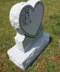 Heart Cemetery Memorial Headstone And Base With Two Design Options, Custom Engraved Gray Granite Upright Monument, Polished Die With Matching Base For Grave; side view of heart-shaped stone in grass