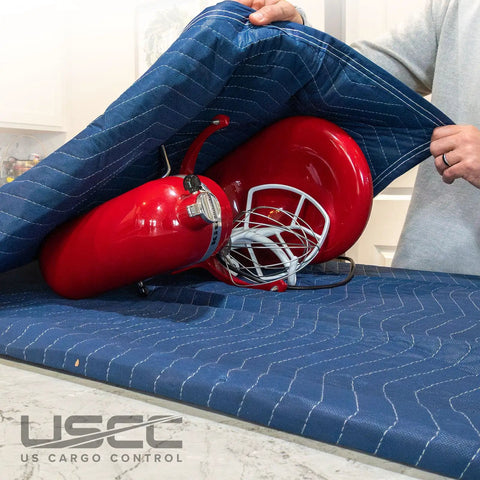 Heavy Duty Moving Blankets 72x80 Inch 12 Pack Blue Polyester Cotton Quilted Furniture Pads covering red items for moving.