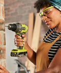Top Notch 18 Volt Power Tool Combo Kit Featuring A Killer Impact Drill Driver and Smooth Cordless Jigsaw with a user drilling into brick.