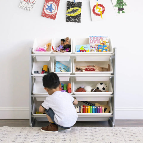 Child playing with a 12 Bin Toy Storage Organizer For Kids Playroom, 4-Tier Toy Organizer In Grey And White, toys neatly arranged