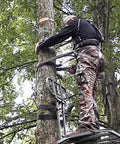 Hunter using LCS Lineman's Climbing Strap for Tree Stand Safety and Quick-Adjust Fit, Heavy-Duty Hunting Gear Built Tough in Black