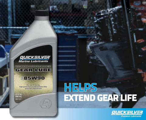 Container of Quicksilver 85W90 Extreme Performance Gear Lube for outboard and sterndrive racing in a workshop setting.