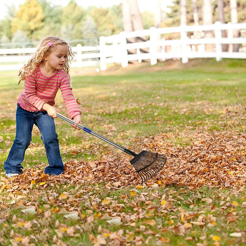 Child using Heavy Duty Garden Rake With Adjustable Long Handle And Stainless Steel Pole Six Feet Tall 25 Tines For Leaves Yard Work Clean Up Windows And Lawn Durable 1.1 Inch Diameter Shaft And Comfy Rubber Grip on lawn